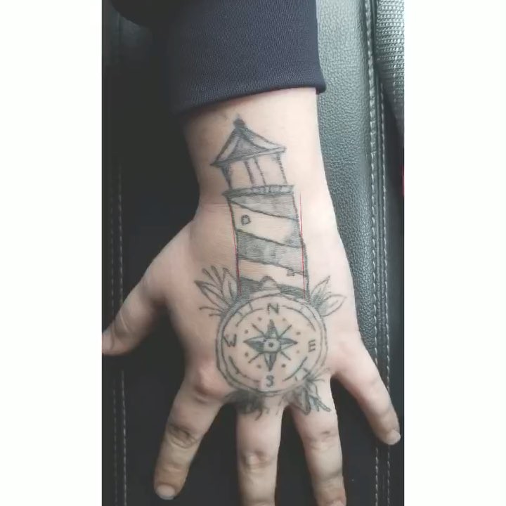 Small Lighthouse Hand Tattoo