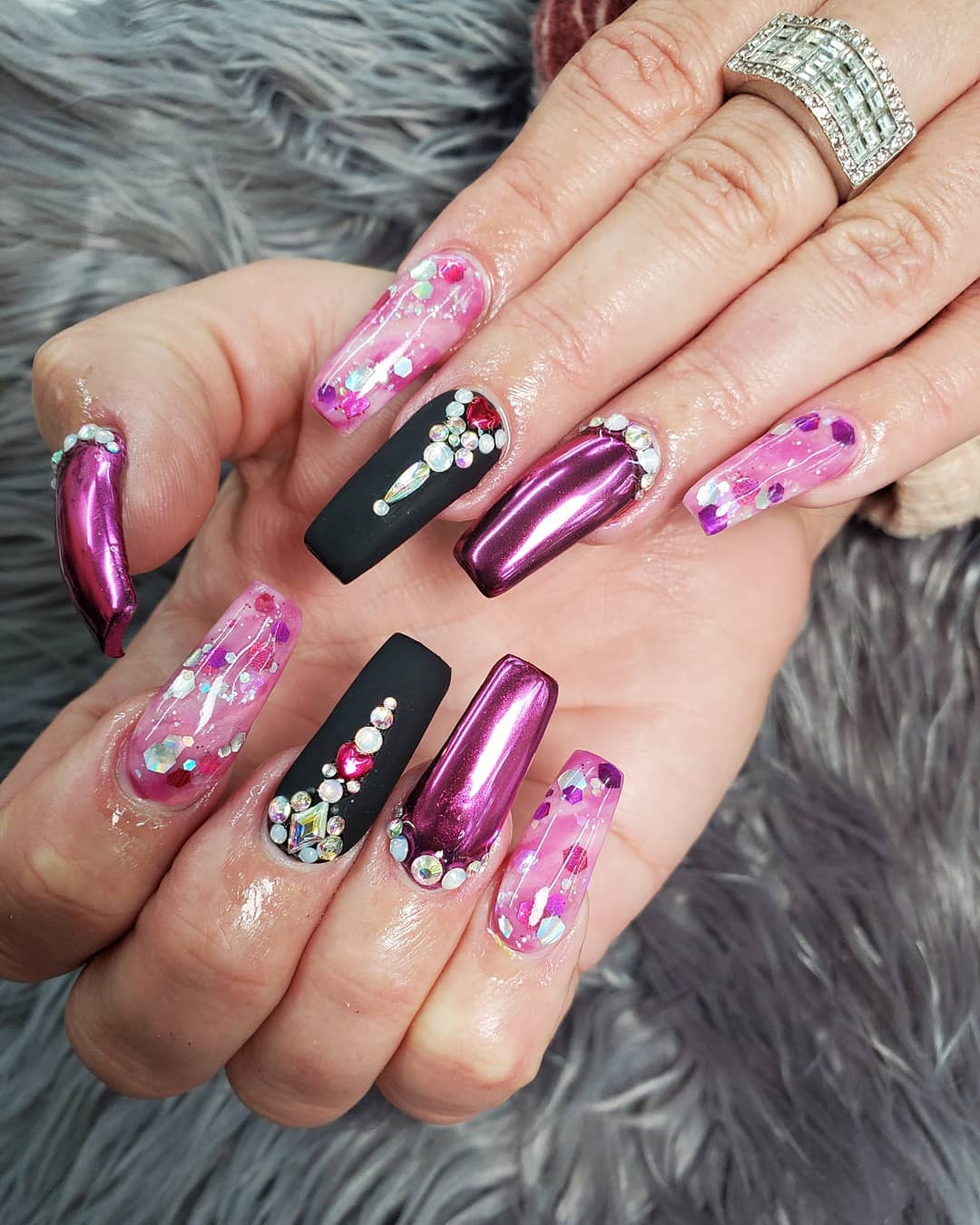 Rhinestones and pink chrome nails