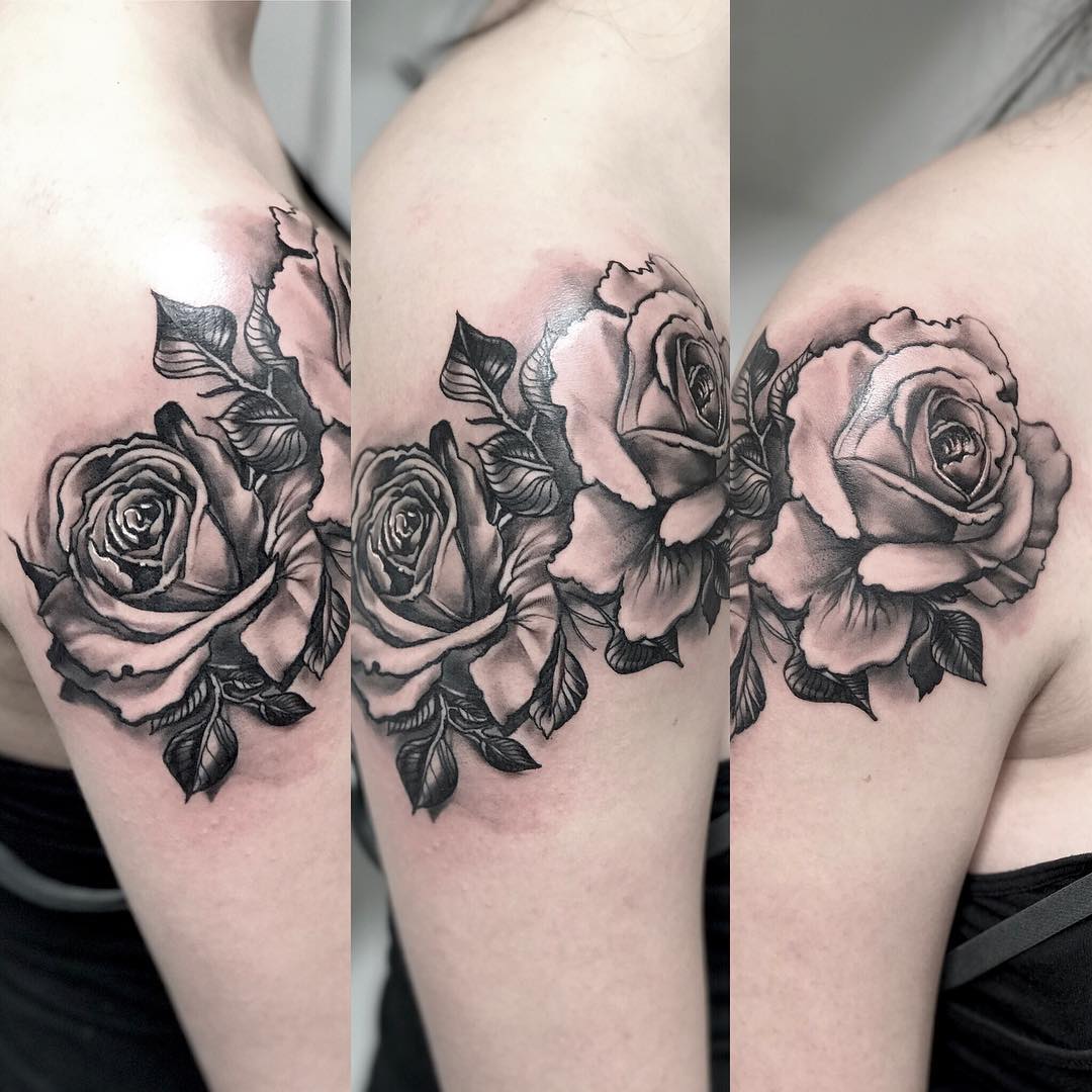 Lightly drawn rose tattoo for shoulder placement