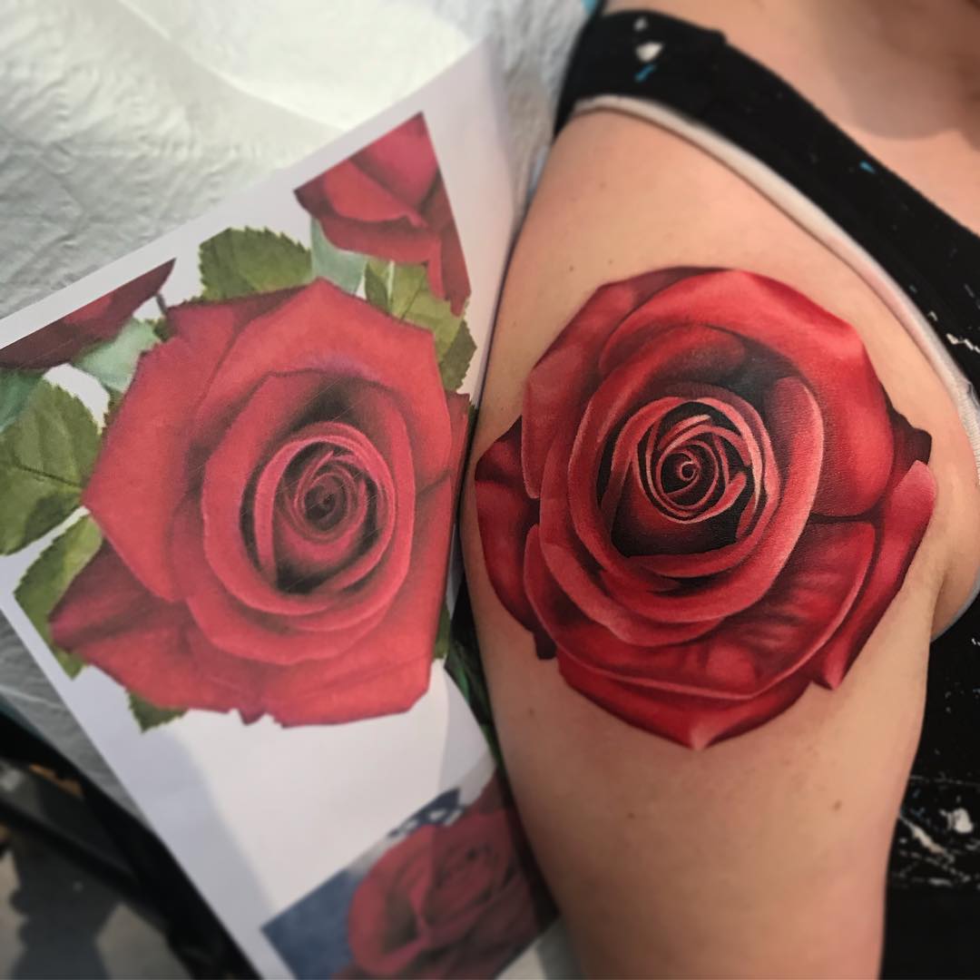 Image of bright red rose tattoo