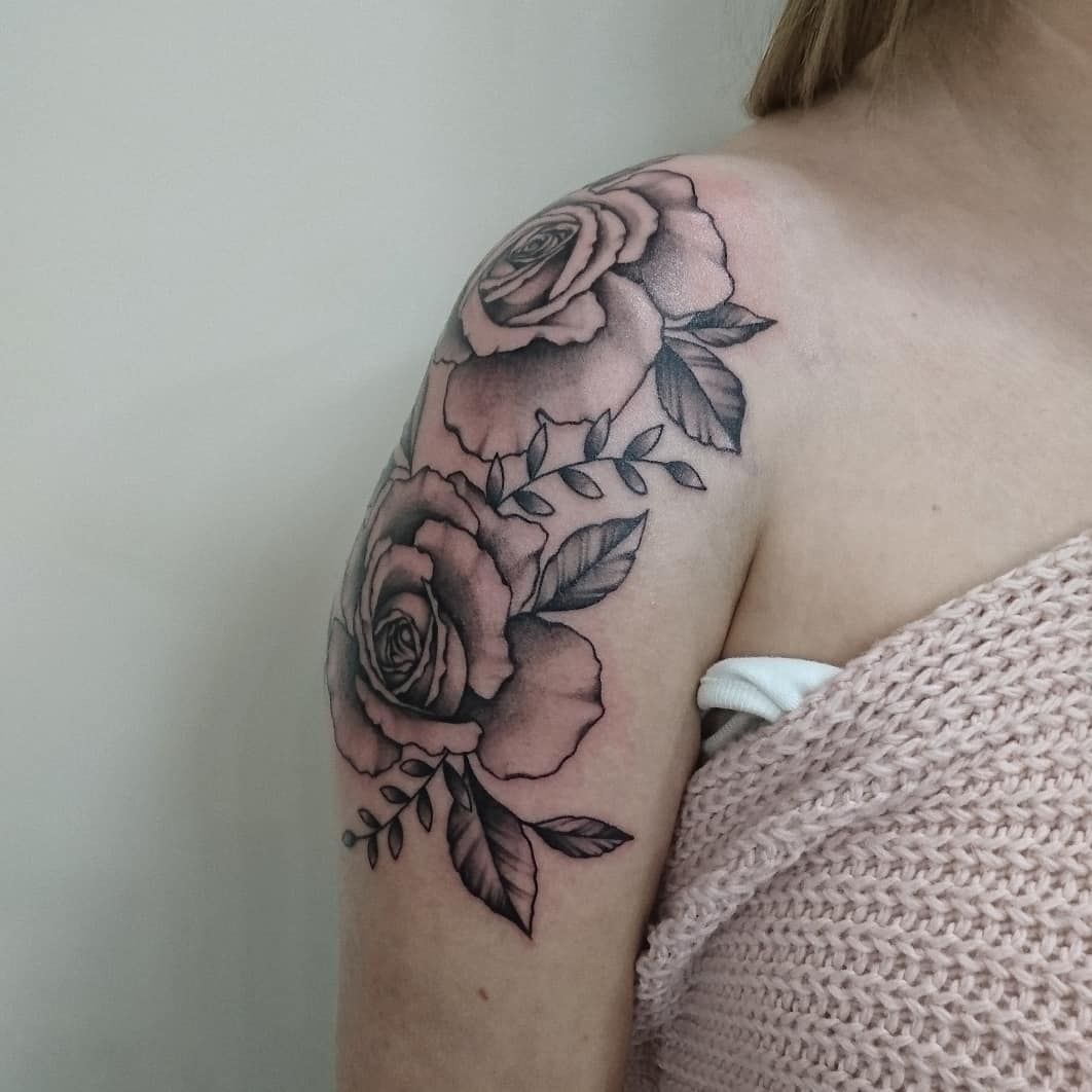 Pink faded rose shoulder tattoo inspiration