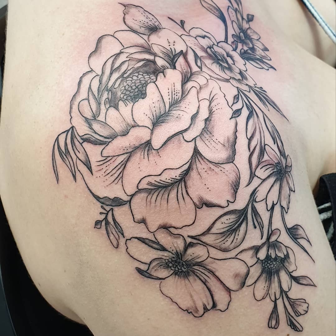 Image of fully bloomed rose shoulder tattoo