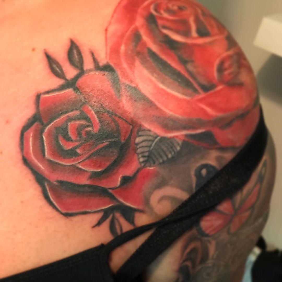 Image of rose shoulder tattoo in red color