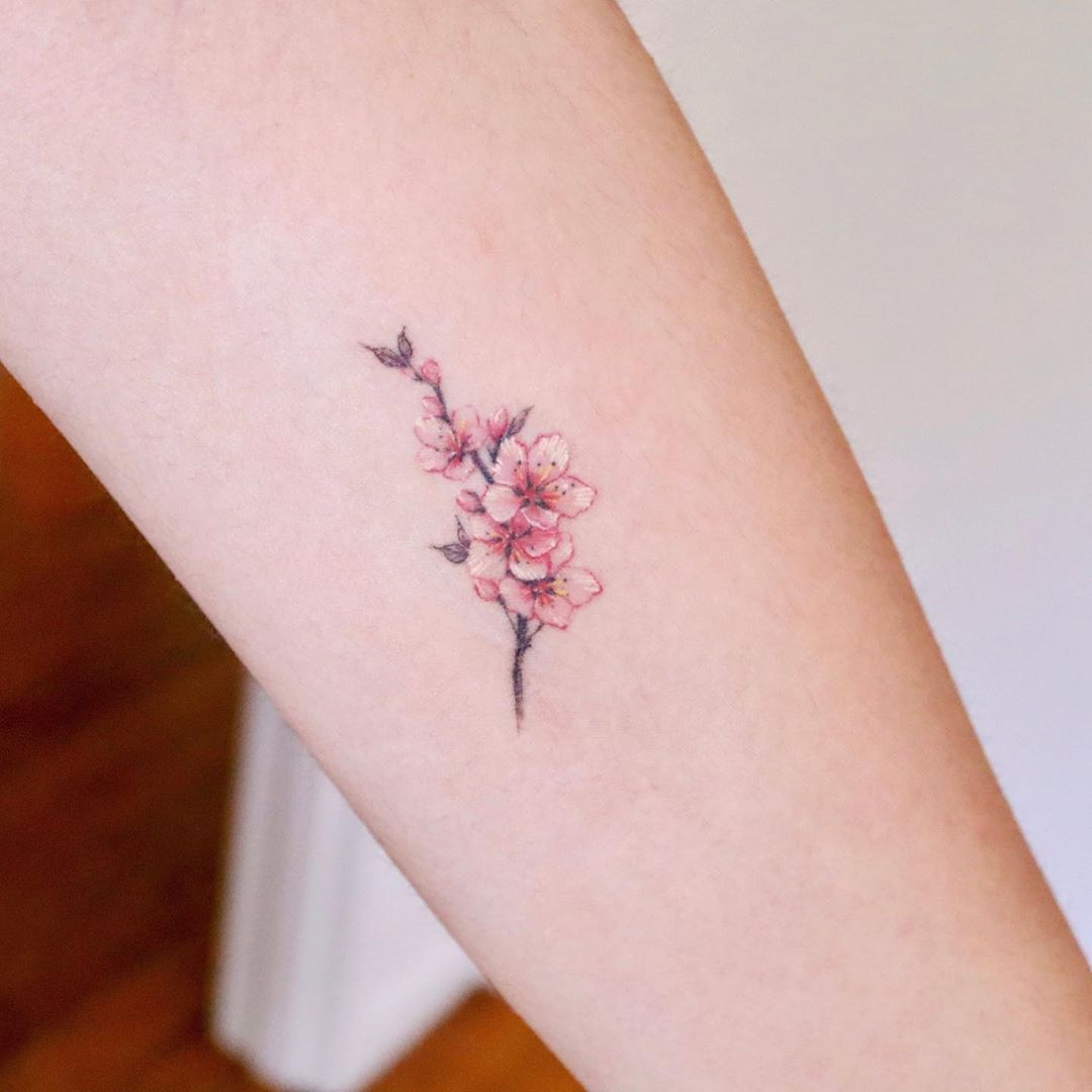 Tiny Japanese Sakura tattoo 