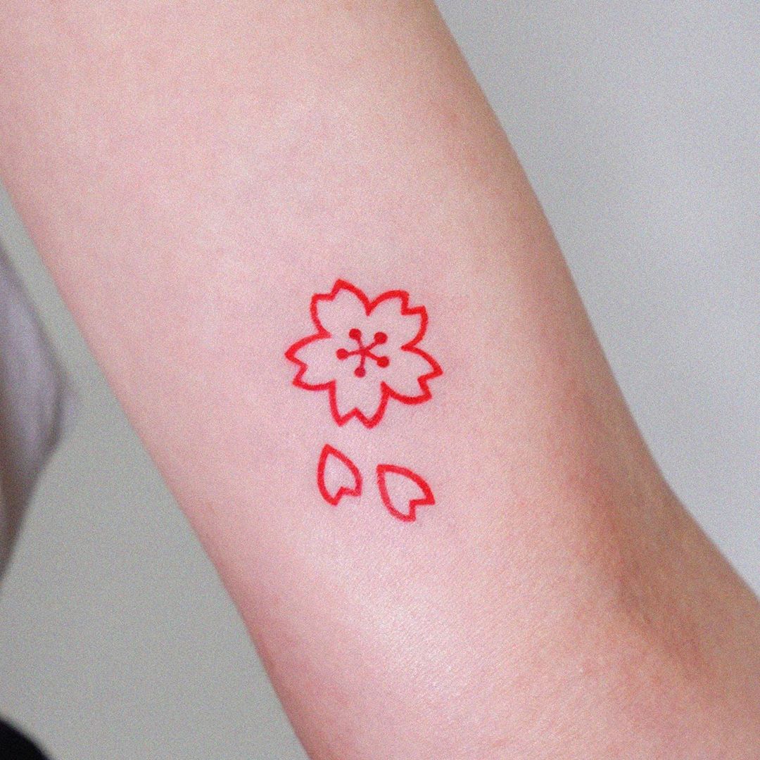 Minimalist Japanese Sakura symbol tattoo
