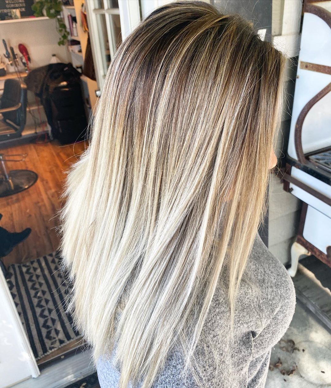 Image of dark roots on a blonde hair style