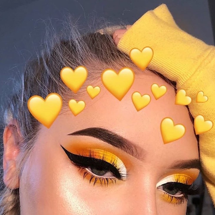 Yellow eyeshadow with winged eyeliner