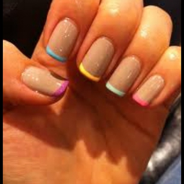 Beautiful image of colored french tips to inspire your next nail look.
