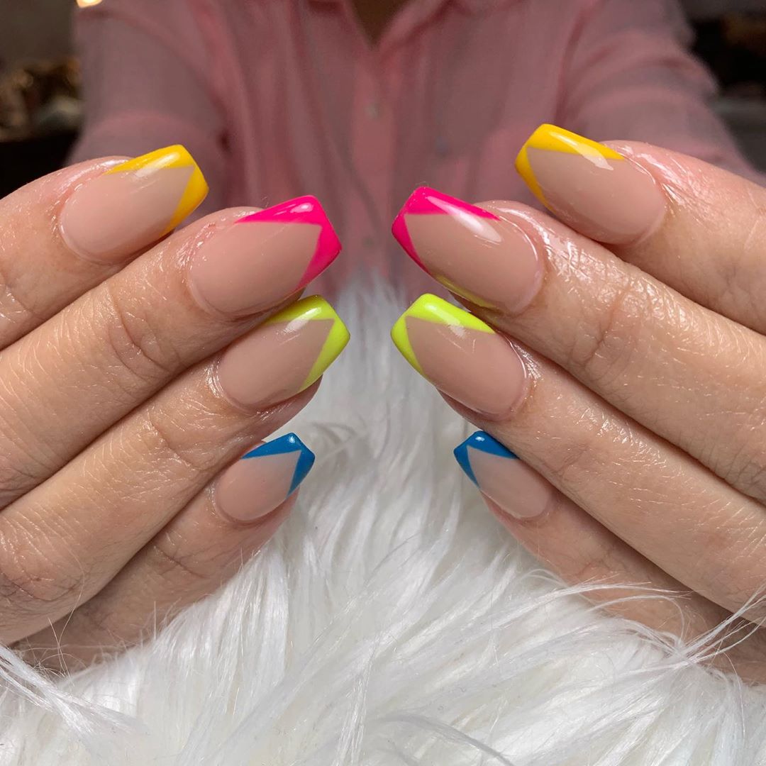 Beautiful image of colored french tips to inspire your next nail look.