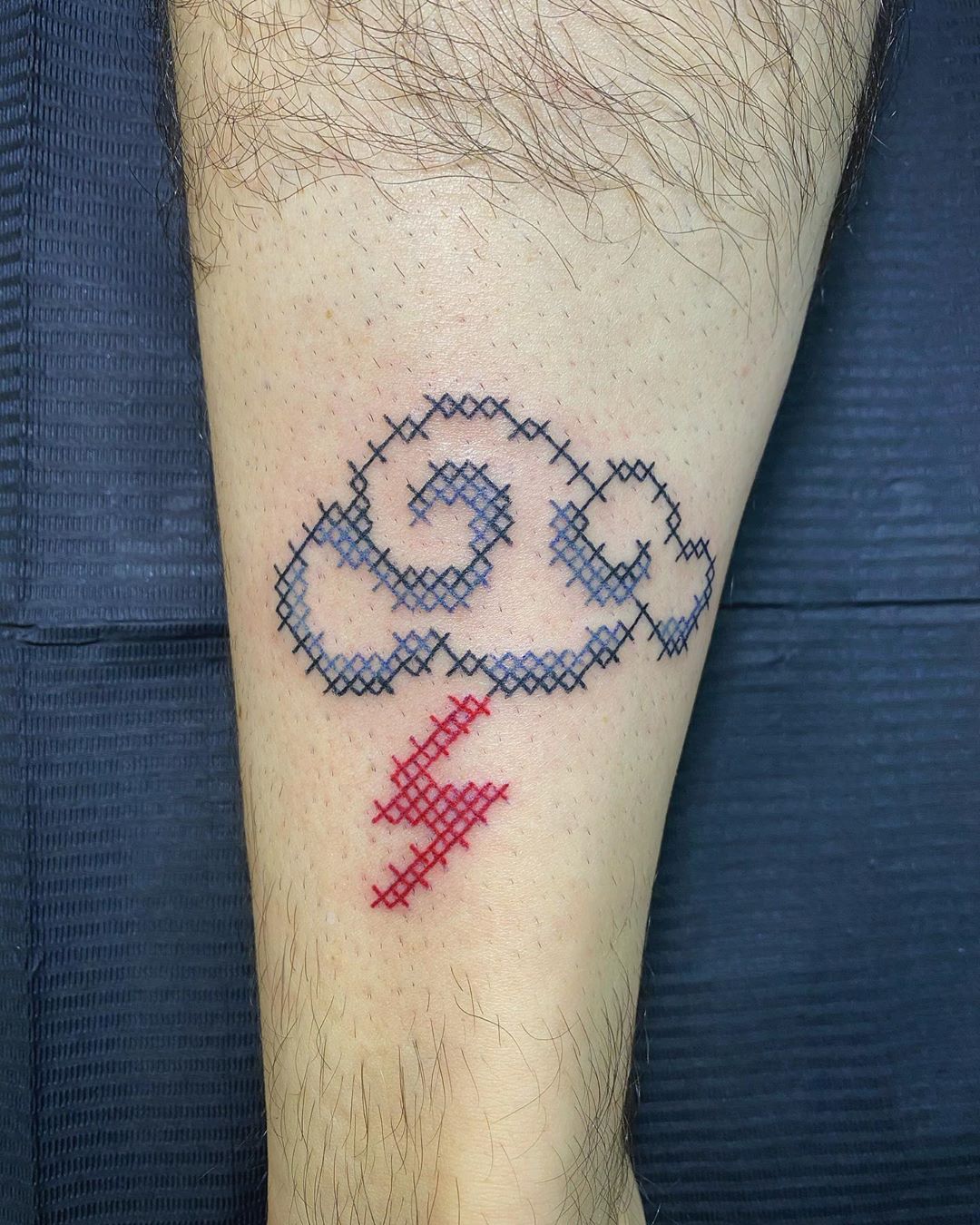 Image of cross stitch tattoo