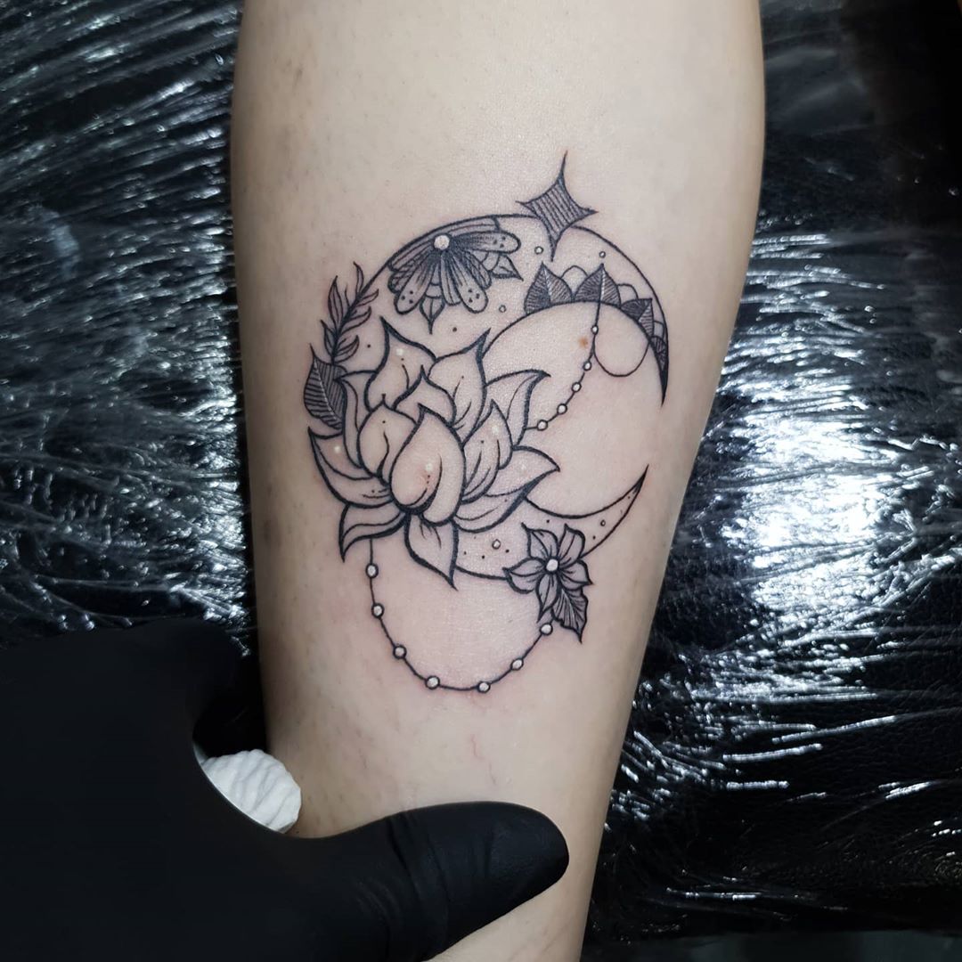 Lotus flower inside Crescent Moon Tattoo
