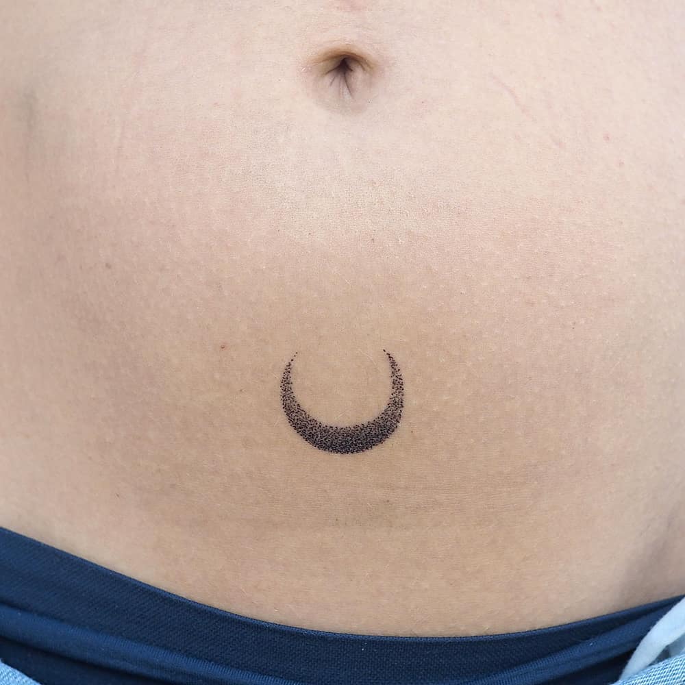 Tiny Crescent Moon Tattoo