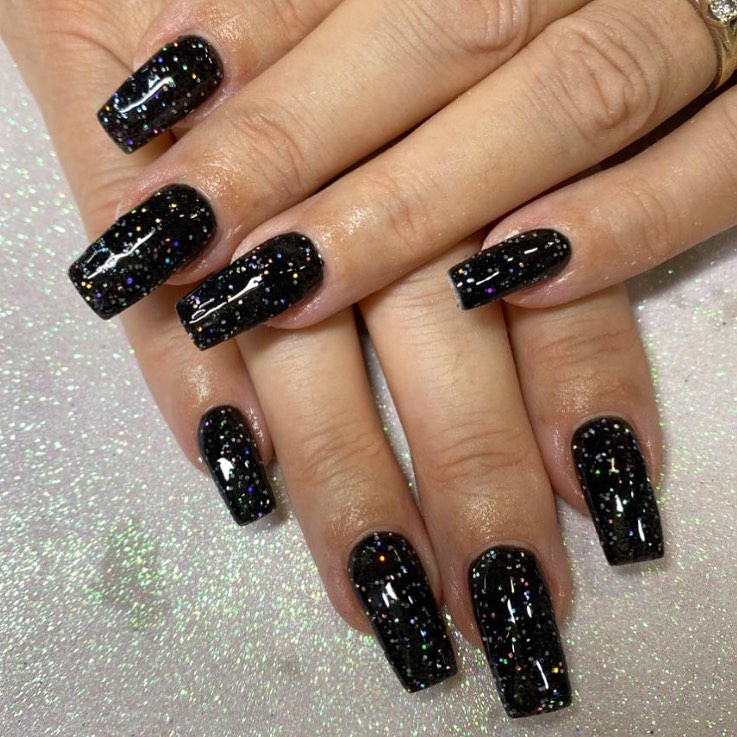 Bold image of a stunning black sparly nail look